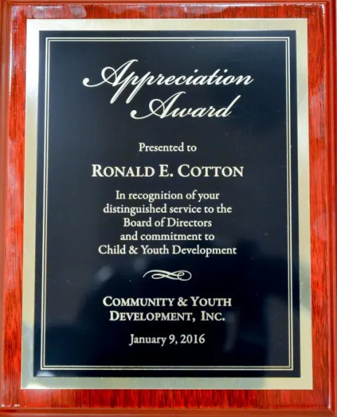 The plaque presented to Ronald E. Cotton
